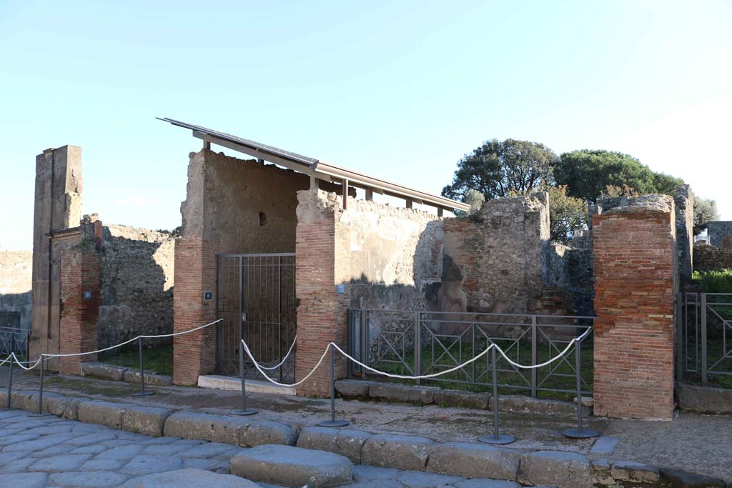 VIII.3.8, Pompeii, centre left. December 2018. 
Looking towards entrances on south side of Via dell’Abbondanza. Photo courtesy of Aude Durand.
