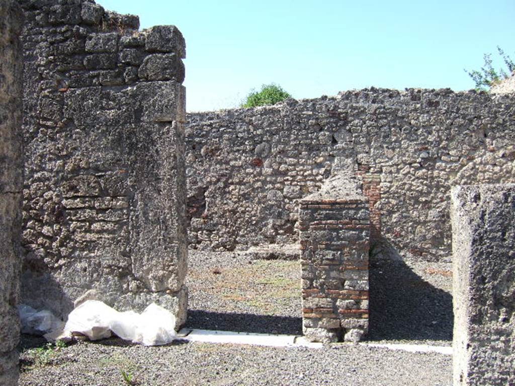 VIII.3.14 Pompeii. September 2005. Looking west from atrium to doorway to triclinium, on left. In the corner of the triclinium, the remains of the ancient stairs to upper floor can be seen. According to Fiorelli, they would have been in communication with the upper floor of the house next-door.
See Pappalardo, U., 2001. La Descrizione di Pompei per Giuseppe Fiorelli (1875). Napoli: Massa Editore. (p.124)
