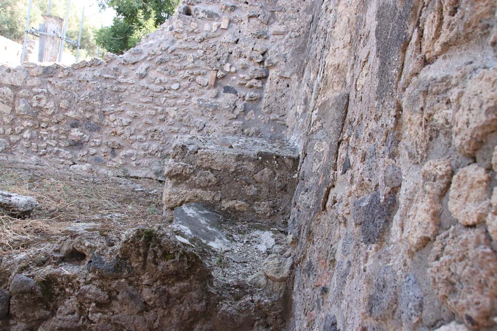 VIII.3.18 Pompeii. September 2021. 
Looking towards east wall in south-east corner of kitchen, and east side of hearth. Photo courtesy of Klaus Heese.
