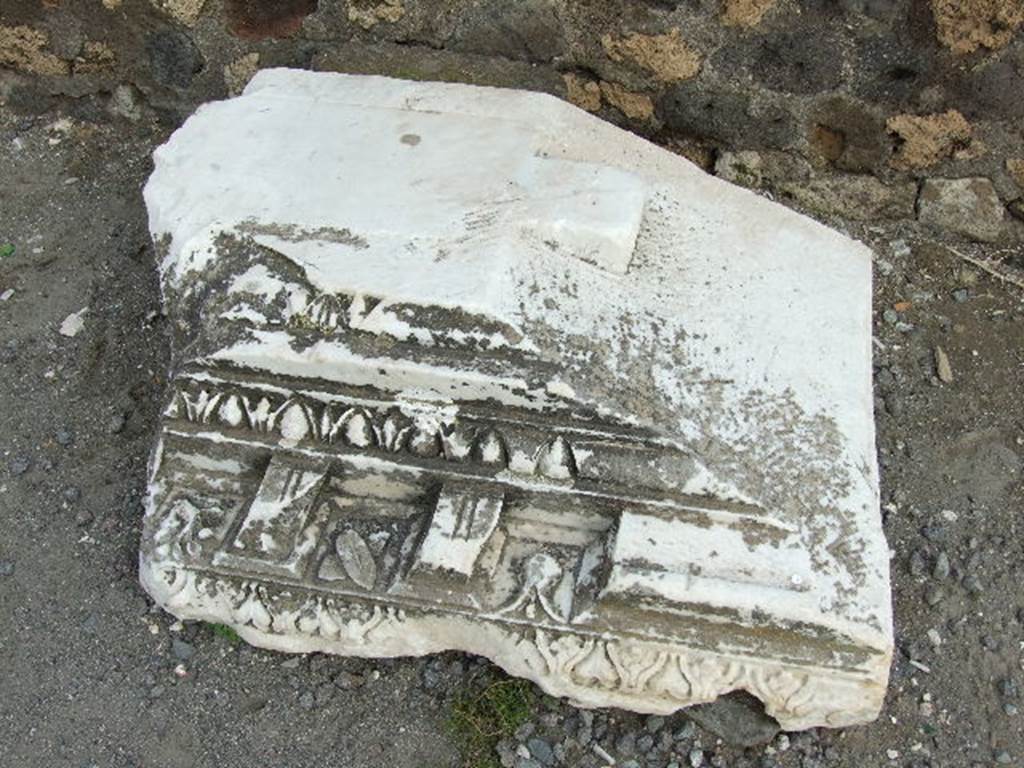 Carved marble outside VIII.3.33. 