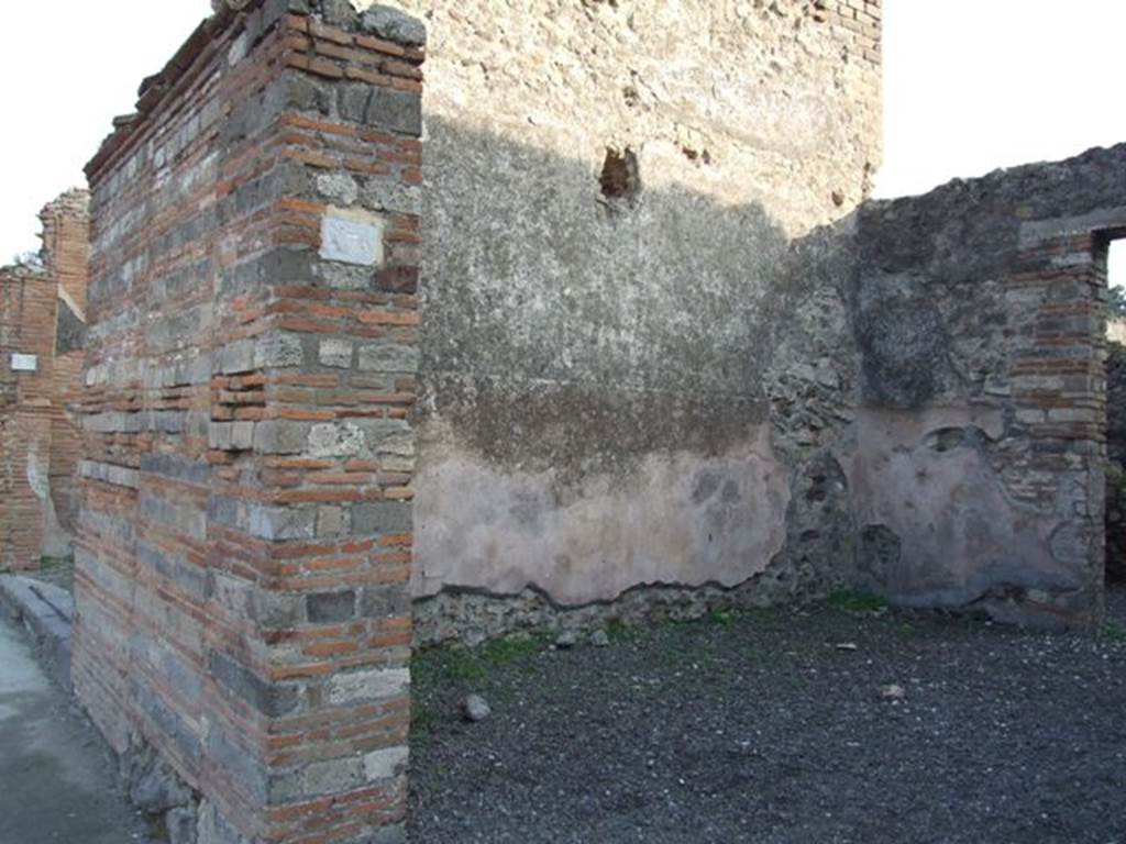 VIII.4.7 Pompeii. December 2007. Entrance and east wall of shop. 
Also showing the pilaster on the left of the doorway, between VIII.4.8 and 7. Painted in red and black, and found in May 1855, on this pilaster were:

Lollium  Fuscum
aed(ilem)  o(ro)  v(os)  f(aciatis)    [CIL IV 734]

N(umerium)  Popidium  Rufum
II vir(um)  Severus  rog(at)     [CIL IV 735]

Postumium
quinq(uennalem)    [CIL IV 736]

L(ucium)  Ceium  Secum  II vir(um)  o(ro)  v(os)  f(aciatis)
Amiullius  Cosmus  cum
(…)ario  rog(at)     [CIL IV 737]

[E]pidium  Sabinum
II vir(um)  Po[st]umi  faciunt    [CIL IV 738]

Lollium
aed(ilem)  o(ro)  v(os)  f (aciatis)    [CIL IV 771]

See Pagano, M. and Prisciandaro, R., 2006. Studio sulle provenienze degli oggetti rinvenuti negli scavi borbonici del regno di Napoli.  Naples : Nicola Longobardi.  (p. 172)
According to Della Corte, the two shops at VIII.4.8 and VIII.4.7 were under the ownership of one (Ianu)arius and another called Severus. He reached this conclusion because the two electoral recommendations were written one near the other on the dividing pilaster of the two shops:
Severus  rog(at)    [CIL IV 735]
and
[CIL IV 737] above, where he interpreted (…)ario as (Ianu)ario.
See Della Corte, M., 1965.  Case ed Abitanti di Pompei. Napoli: Fausto Fiorentino. (p. 236)
