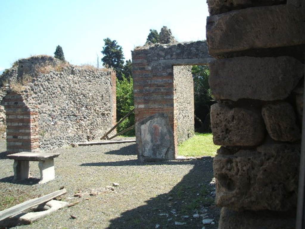 VIII.4.9 from VIII.4.8 Pompeii. May 2005. Looking south-east across atrium through tablinum to remains of peristyle.