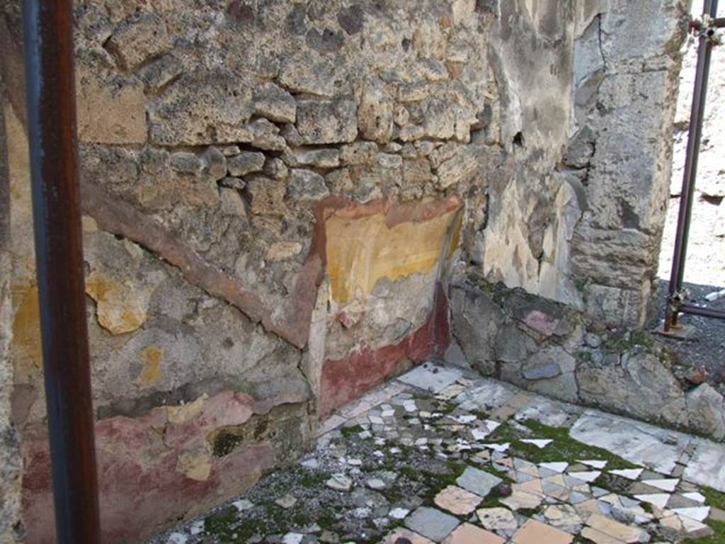 VIII.4.15 Pompeii. March 2009. Room 18, cubiculum with recess in north-west corner, with remains of painted plaster. The zoccolo/plinth was painted with red panels containing painted plants and the middle zone of the wall was yellow.
