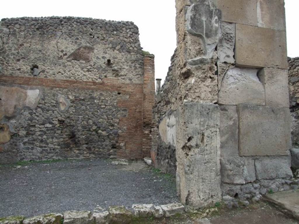 VIII.4.25 Pompeii. December 2007. North wall of shop. The north wall was decorated with a red zoccolo/plinth. The middle zone of the wall was decorated with yellow and white panels. 
See Bragantini, de Vos, Badoni, 1986. Pitture e Pavimenti di Pompei, Parte 3. Rome: ICCD. (p.344)
