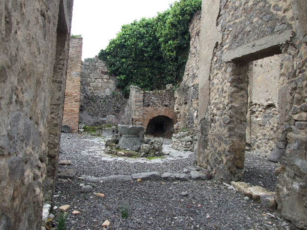 VIII.4.27 Pompeii.  December 2006. Looking west towards atrium converted to bakery. Della Corte said this was an ancient atrium, made into a bakery together with the adjoining dwelling. At the time of the eruption it was probably in the possession of a man named Felix, known because of an electoral recommendation. Found written to the left of the entrance:  Felix rog(at)  [CIL IV 1008].
See Della Corte, M., 1965.  Case ed Abitanti di Pompei. Napoli: Fausto Fiorentino. (p.262)
