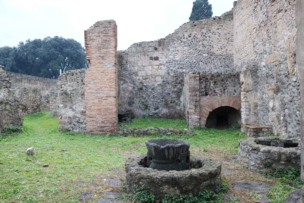VIII.4.27 Pompeii. December 2018. 
Looking west across bakery, with doorway to rear rooms, on left. Photo courtesy of Aude Durand.
