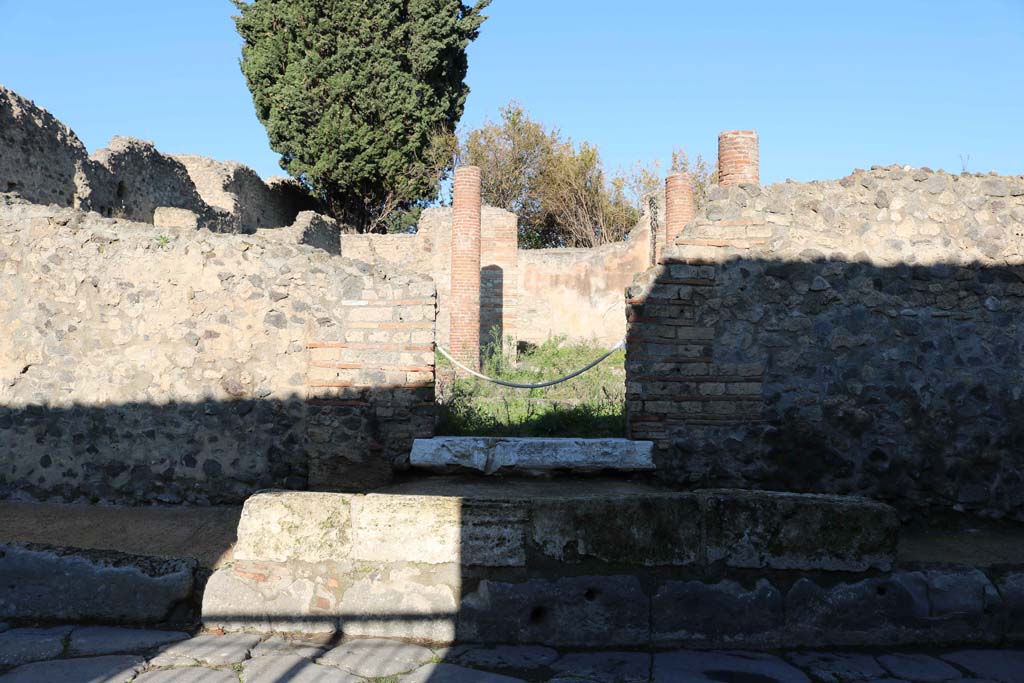 VIII.4.34 Pompeii. December 2018. 
Looking north to entrance doorway on a raised ramp in pavement. Photo courtesy of Aude Durand.
