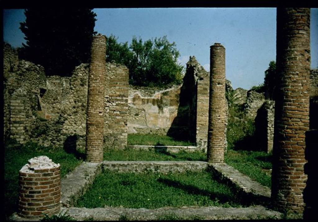 VIII.4.34 Pompeii.  Impluvium with four columns.  Photographed 1970-79 by Günther Einhorn, picture courtesy of his son Ralf Einhorn.

