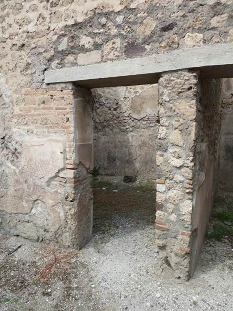 VIII.4.37 Pompeii. September 2015. Doorway to room on west side of north wall of central courtyard.