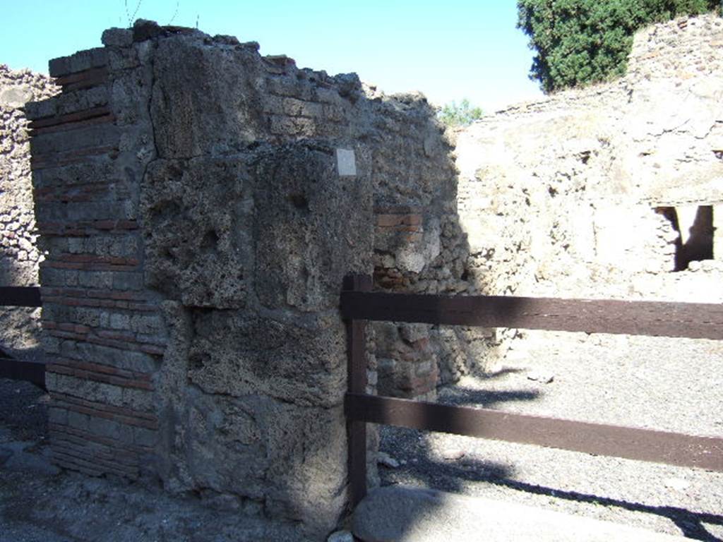 VIII.4.44 Pompeii. September 2005. North wall of shop, with site of steps to upper floor.
