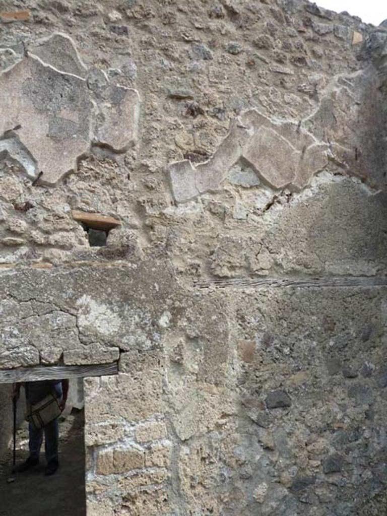 VIII.4.44 Pompeii. September 2015. Remains of plaster from east wall of upper floor room, above room at rear of triclinium.