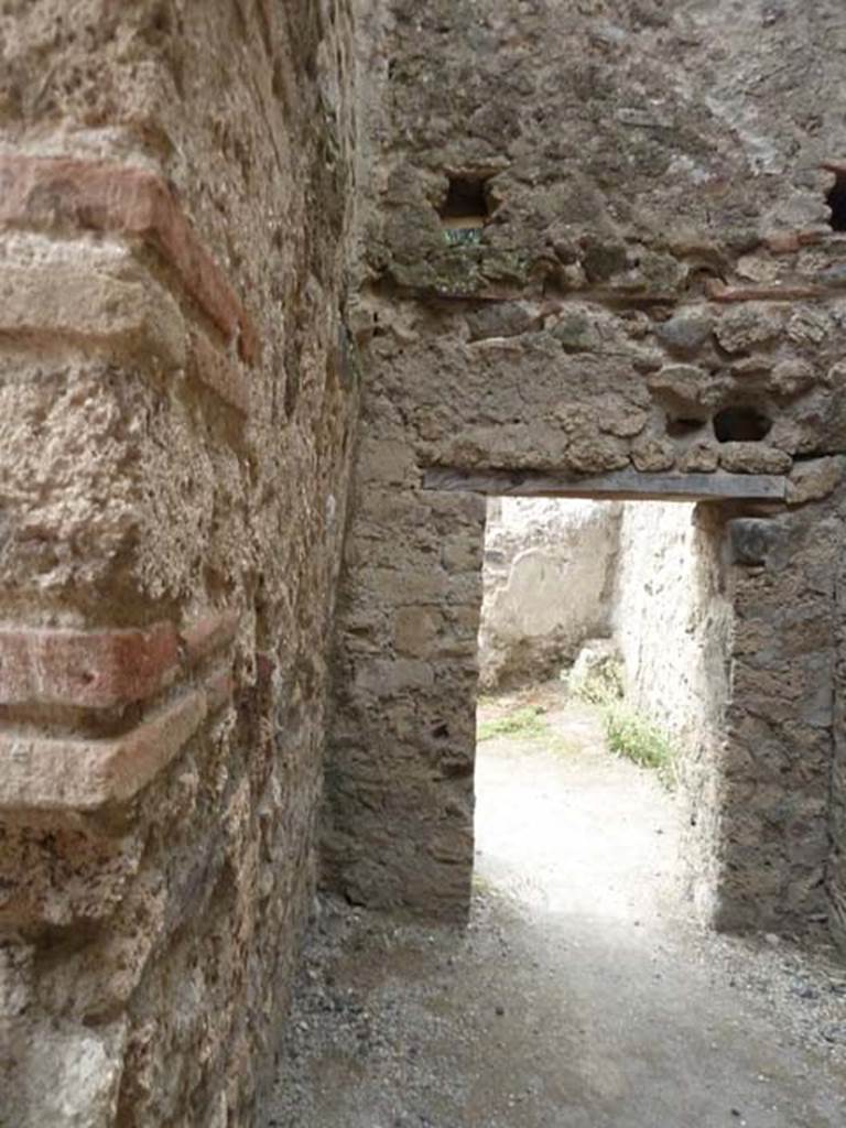 VIII.4.44 Pompeii. September 2015. Looking west towards doorway to room behind triclinium.


