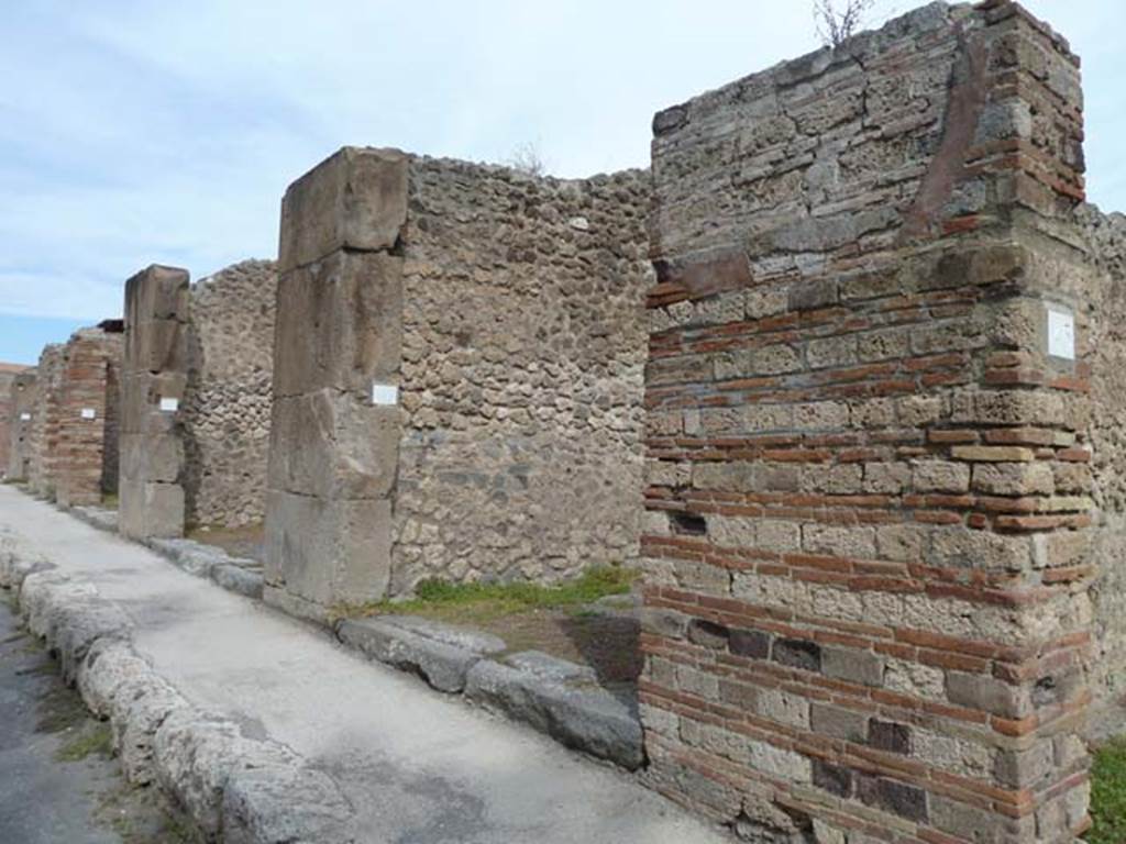 VIII.4.46 Pompeii. September 2015. Looking north-east towards entrance doorway on east side of Via dei Teatri.