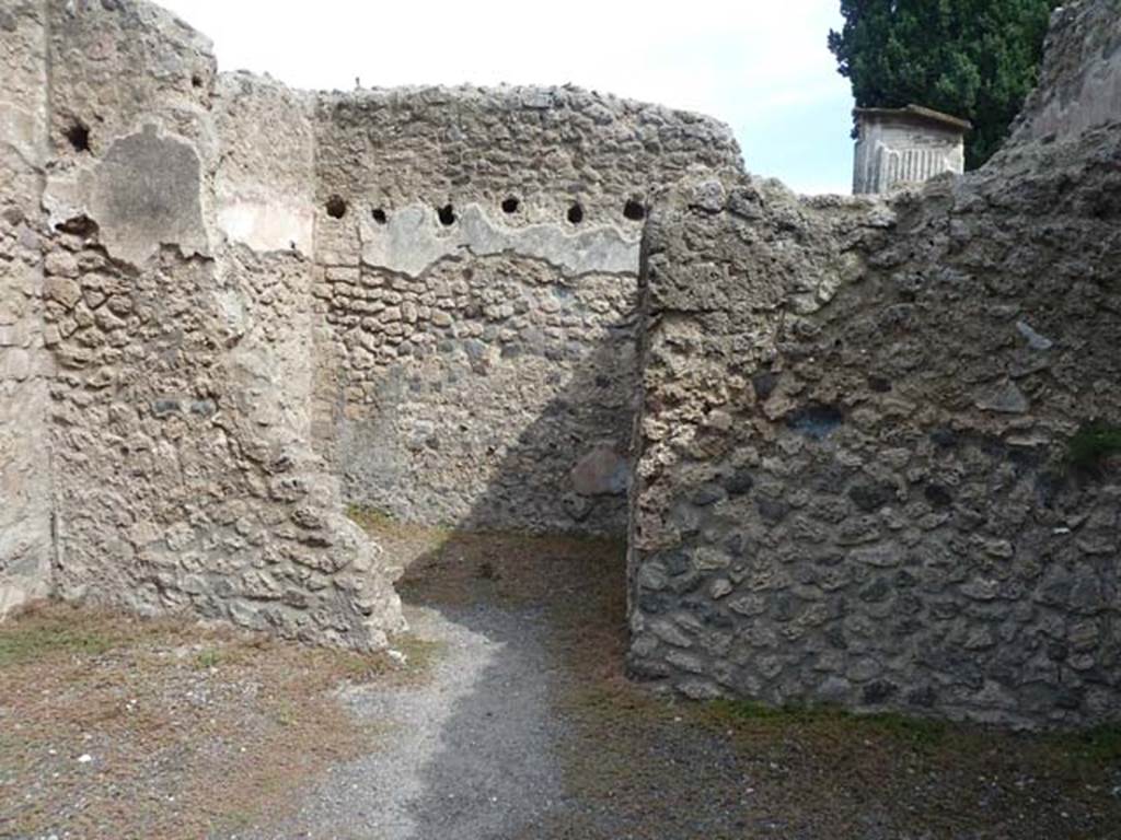 VIII.4.47 Pompeii. September 2015. East wall of shop-room with doorway to rear room.