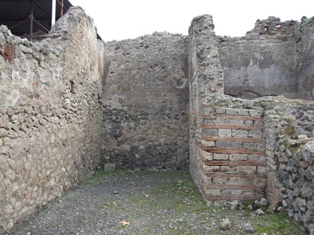 VIII.4.50 Pompeii. December 2007.  Rear room and east wall. The stairs to the upper floor were In the rear room, and the latrine was under the stairs.