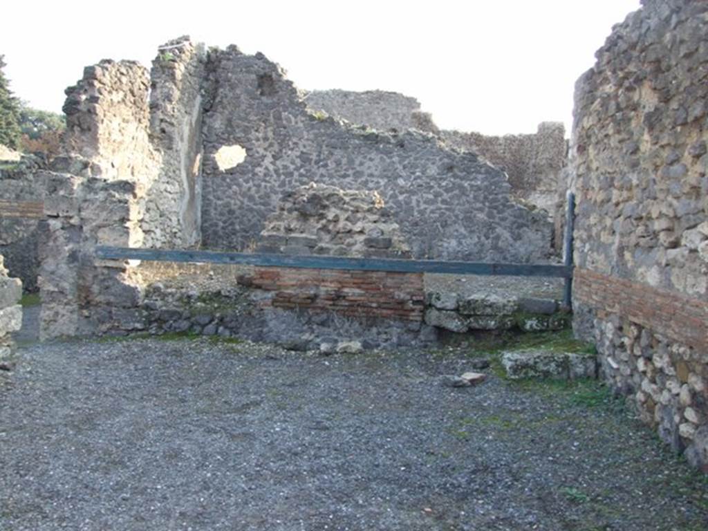 VIII.5.11 Pompeii.  Shop.  December 2007.  Shop in foreground, with step and doorway to VIII.5.9 at rear.