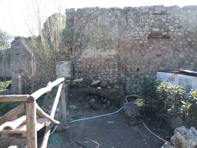 VIII.5.15 Pompeii. March 2009. Room 3, south side of remains of kitchen, with hearth.  