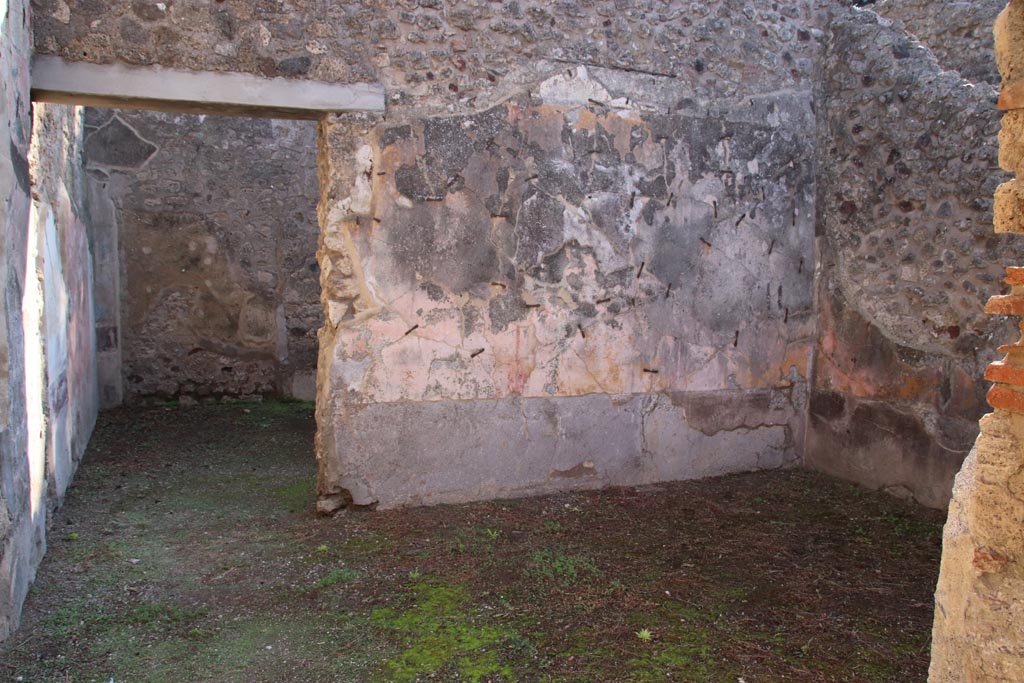 VIII.5.16 Pompeii. October 2022. Room 6, looking east from doorway through to doorway to room 7 in east wall.
Photo courtesy of Klaus Heese. 
