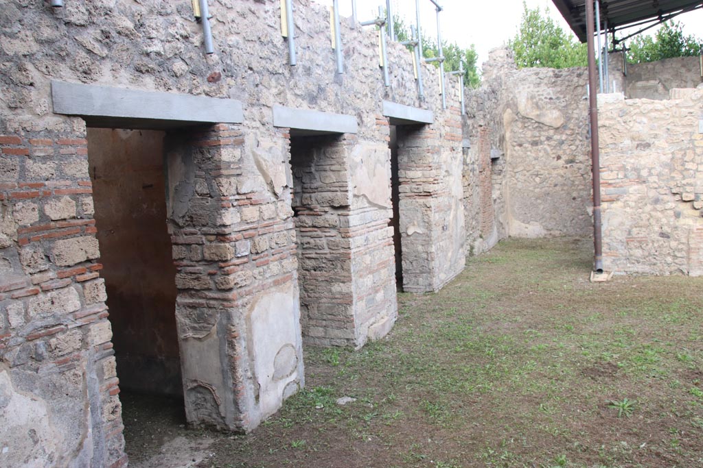 VIII.5.39 Pompeii. October 2023. 
Looking north along doorways to rooms on west side of atrium from entrance doorway. Photo courtesy of Klaus Heese.
