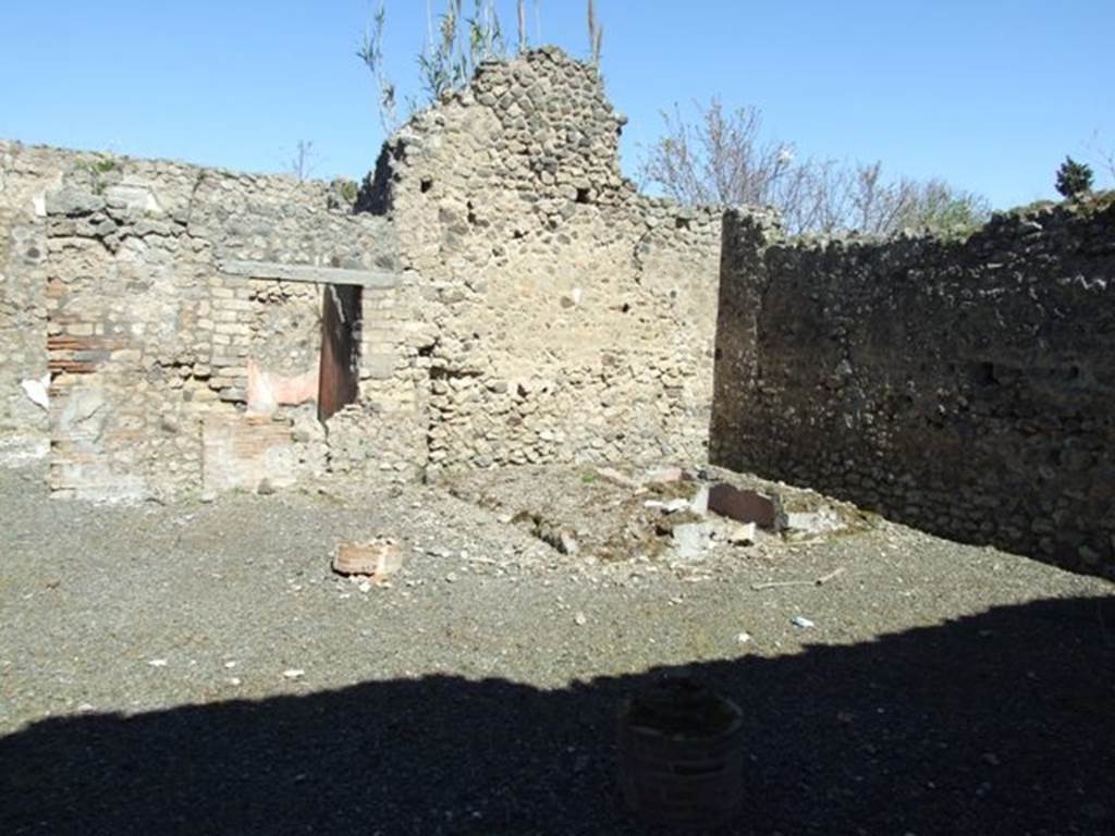 VIII.5.39 Pompeii. March 2009. Room 1, looking north-east from entrance.
According to Jashemski –
“The street entrance led directly into a two-storied portico supported by two columns. 
The portico was separated from the small garden on the right by a low wall, which had an entrance into the garden.
There was a gutter along the west edge of the garden. 
In the north part of the garden was a masonry triclinium (l. medius, 2.63m; l. imus, 3.45m; l. summus 3.10m) and a table (0.59m diameter), faced with marble of various colours, which had a hole in the centre for a fountain jet.
The garden was decorated with many small garden sculptures –
Five small heads of Bacchic herms (0.16m high), Naples Muz. Nat. inv. nos. 120 036 – 120 040.
A tragic mask (oscillum) (0.16m high), Naples Muz. Nat. inv. no. 120 041.
A toad fountain, lacking head (0.14m long), Naples Muz. Nat. inv. no. 120 042.
A tortoise for a fountain, lacking head (0.12m long), Naples Muz. Nat. inv. no. 120 043.
Two small brackets, Naples Muz. Nat. inv. no. 120 044, 120 045.
Two fluted monopodia with the Greek inscription “of Serapion”.
Jashemski sources –
Sogliano, NSc, (1882), p.280, 324, 359-360;
Mau, BdI, (1884) p. 127-129;
Mau-Kelsey, p.341-3, plan on p.341;
Boyce, p. 78, no.372; 
Soprano, p. 301, no. 16,
Dohn, p.46-47’
Dwyer, ”Oscilla”, p. 281, no. 106.
See Jashemski, W. F., 1993. The Gardens of Pompeii, Volume II: Appendices. New York: Caratzas. (p.218).

