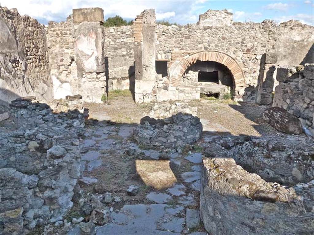 VIII.6.11 Pompeii. September 2011. Looking east across bakery. 
The doorway to the room in north-east corner is in the centre left. The rooms on the south side of the bakery room are on the right.
