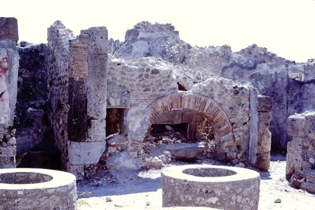 VIII.6.11 Pompeii. 1968. Looking south-east across bakery and oven.  Photo by Stanley A. Jashemski.
Source: The Wilhelmina and Stanley A. Jashemski archive in the University of Maryland Library, Special Collections (See collection page) and made available under the Creative Commons Attribution-Non Commercial License v.4. See Licence and use details.
J68f1068
