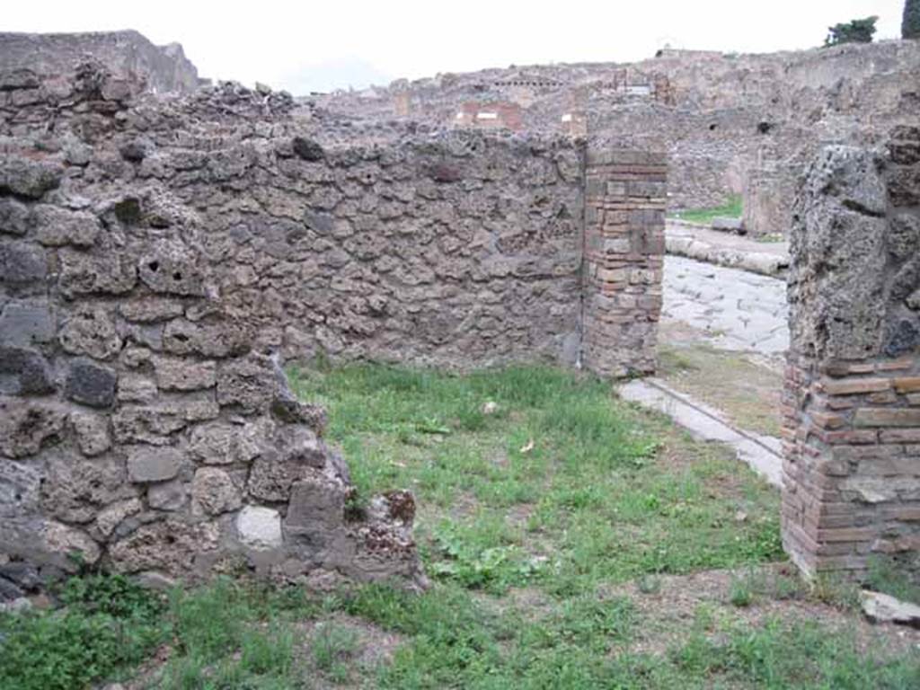 VIII.7.3 Pompeii. September 2010.  Looking north through remains of doorway into VIII.7.4, with Via Stabiana on the right. Photo courtesy of Drew Baker.
