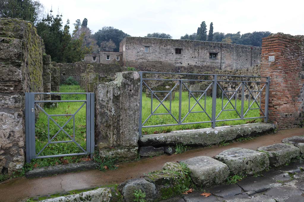 VIII.7.7 Pompeii, on left, and VIII.7.8. December 2018. 
Looking west to entrance doorways on Via Stabiana. Photo courtesy of Aude Durand.

