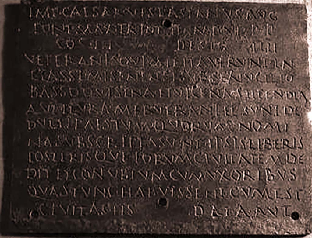 VIII.7.8 Pompeii. Inner part 3 of decree of discharge of M. Surus Garasenus.
Now in Naples Archaeological Museum. Inventory number 110043.

The Epigraphic Database Roma records

Ìmp(erator) Caesar Vespasianus Aug(ustus),
pont(ifex) max(imus), tr(ibunicia) pot(estate) I̅I̅, imp(erator) VI, p(ater) p(atriae),
co(n)s(ul) III, desig(natus) I̅I̅I̅I̅,
veteranìs, quì militaverunt in
classe Misenensi sub Sex(to) Lucilio 
Basso, quì sena et vicena stipendia
aut plura meruerant et sunt de=
ductì Paestum, quorum nomi=
na subscripta sunt, ipsis liberis
posterisque eorum civitatem de= 
dit et conubium cum uxoribus,
quas tunc habuissent, cum est
cìvitas iìs data, aut,      [CIL X 867]
