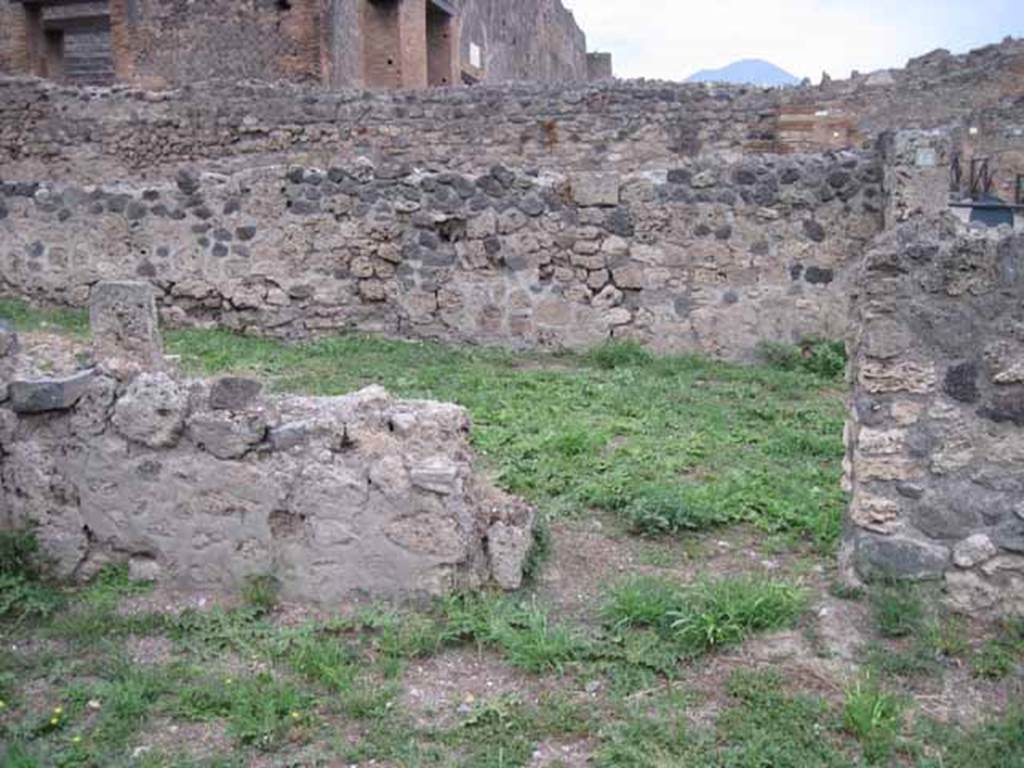 VIII.7.13 Pompeii. September 2010. North wall of shop, with doorway into VIII.7.14. Photo courtesy of Drew Baker.
