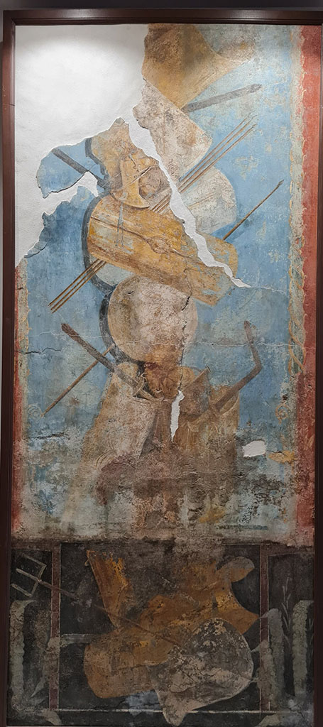 VIII.7.16 Pompeii. Wall of the exedra. 
Painting of trophy of arms above a painting of the arms used by gladiators.
This is the larger fresco, 252.4cm high by 112 cm wide.
Now in Naples Archaeological Museum. Inventory number 9702.
See Sampaolo V., Frammenti di affreschi con armi gladiatorie in Restituzione: Tesori d’arte restaurati 2013, p. 103.
Photo courtesy of Giuseppe Ciaramella.
