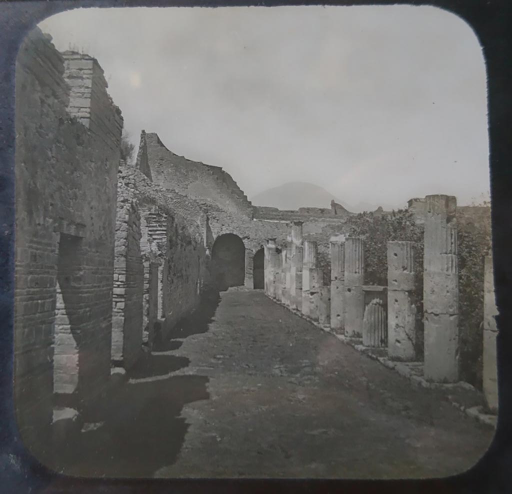 VIII.7.16 Pompeii. c.1900. C. and G. Lantern slide published by A. Laverne. Looking north along west portico of peristyle.    