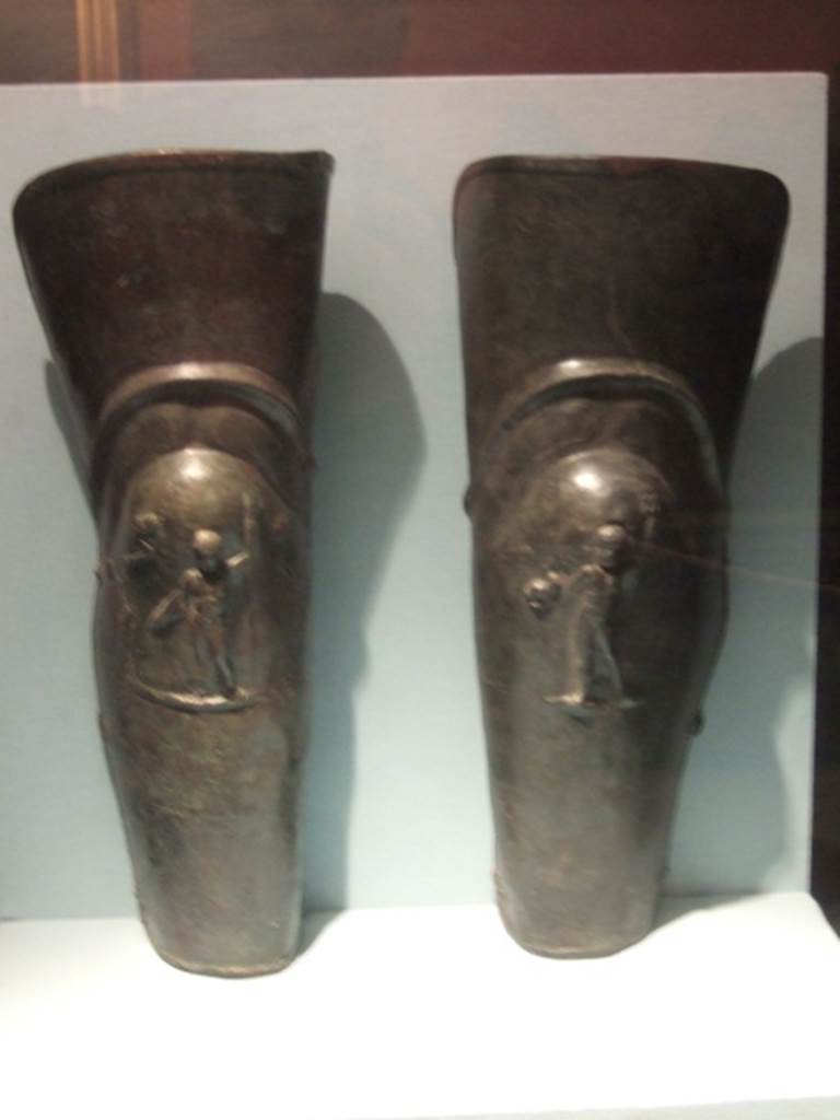 VIII.7.16 Pompeii.  December 2007.  Pair of bronze leggings or Gladiator’s Greaves, found in the barracks.