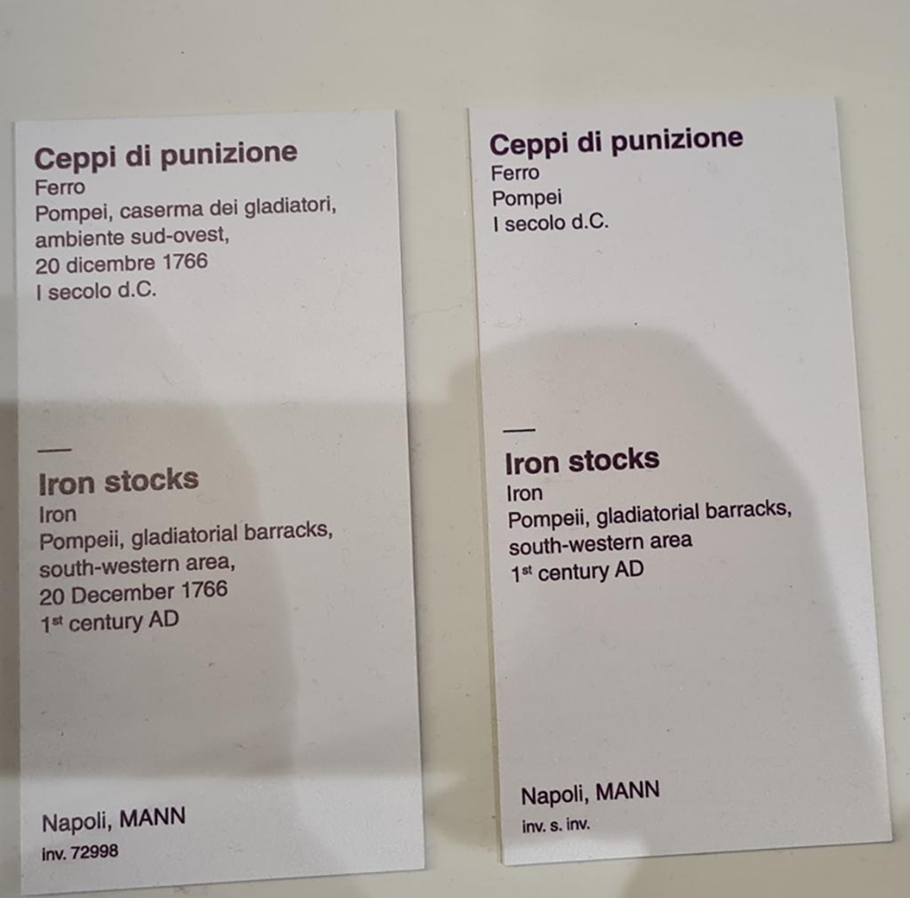 VIII.7.16 Pompeii. Description card for iron stocks in Naples Archaeological Museum. Photo taken May 2021, courtesy of Giuseppe Ciaramella.