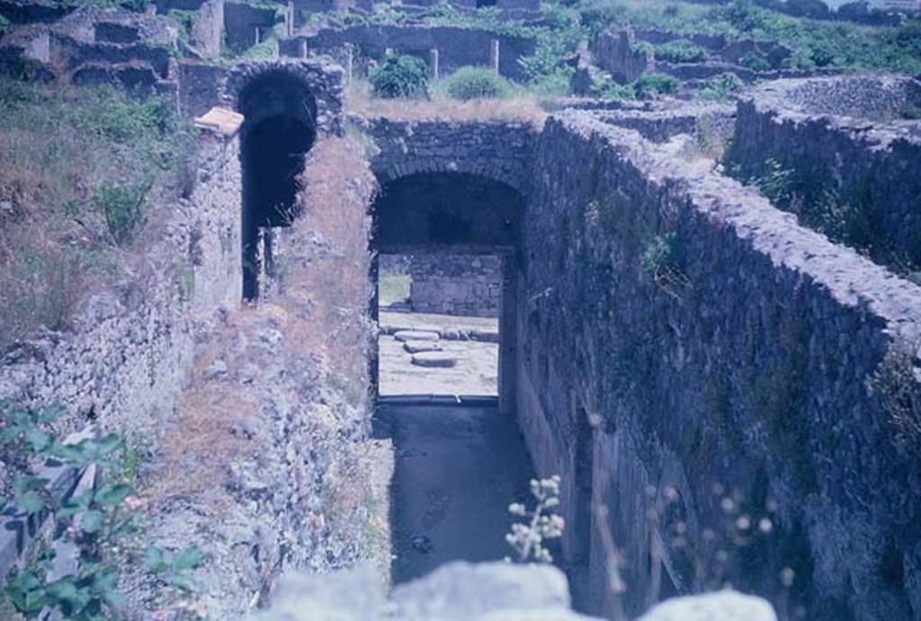 VIII.7.21 Pompeii (on left) and VIII.7.20 (centre). June 1962. 
Looking east from entrance corridors towards Reg. 1, insula 3. Photo courtesy of Rick Bauer.


