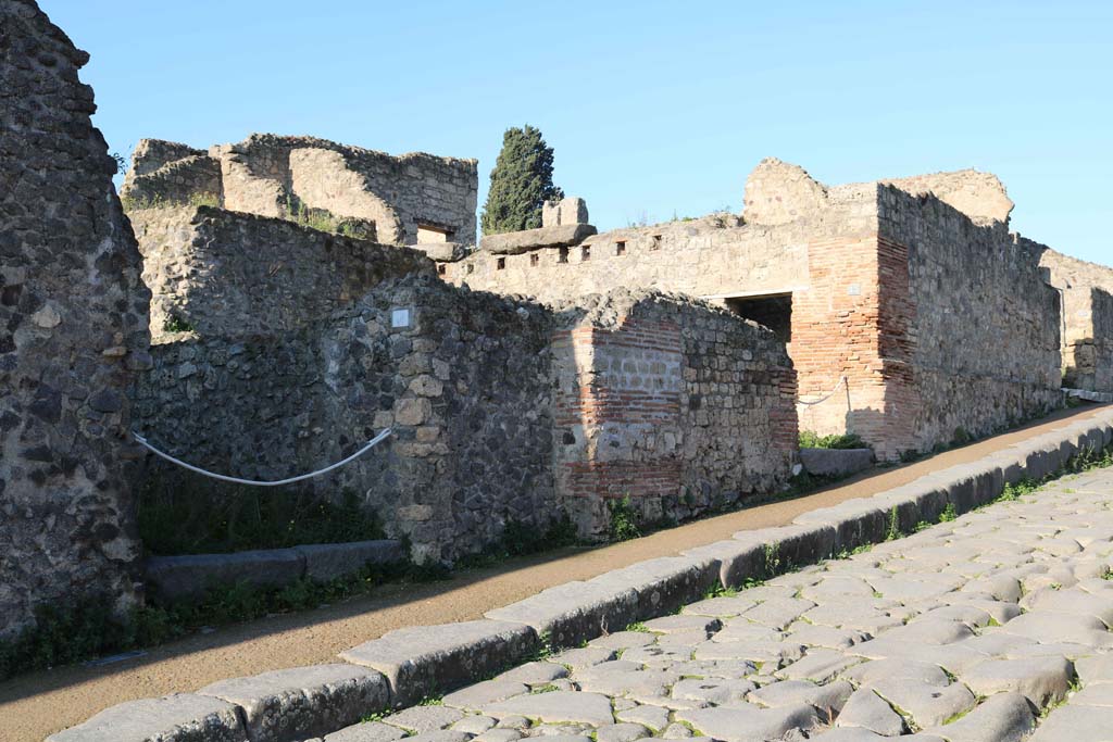 VIII.7.22, on left, and VIII.7.23, on right, Pompeii. December 2018. 
Looking north along west side of Via Stabiana. Photo courtesy of Aude Durand.
