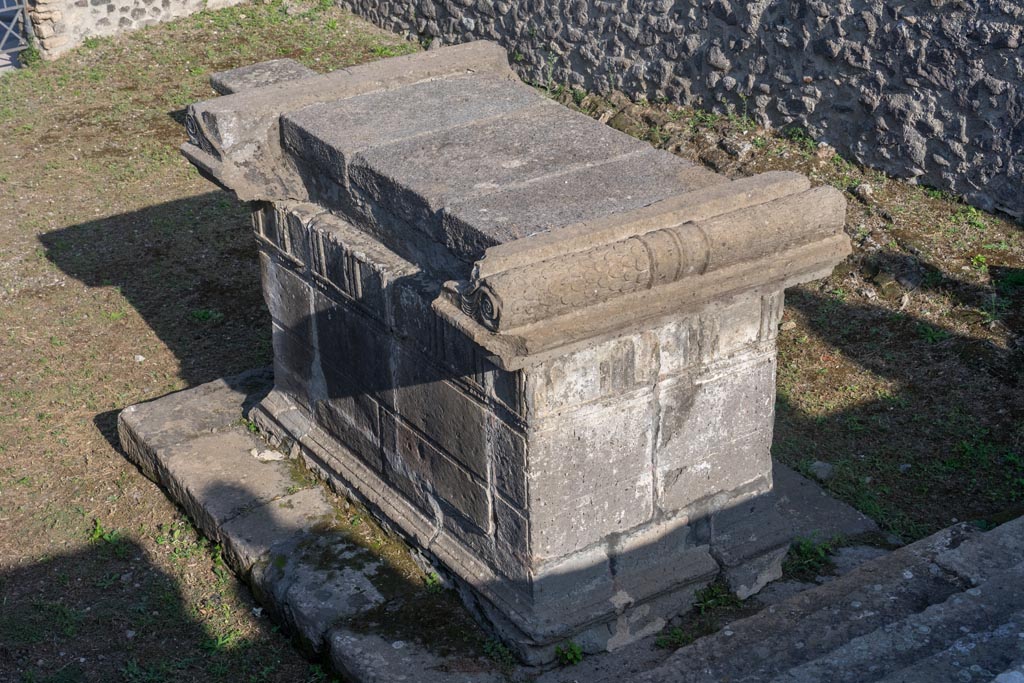 VIII.7.25 Pompeii. October 2023. 
Looking towards north and west sides of altar, from top of stairs to podium with cella. Photo courtesy of Johannes Eber.
