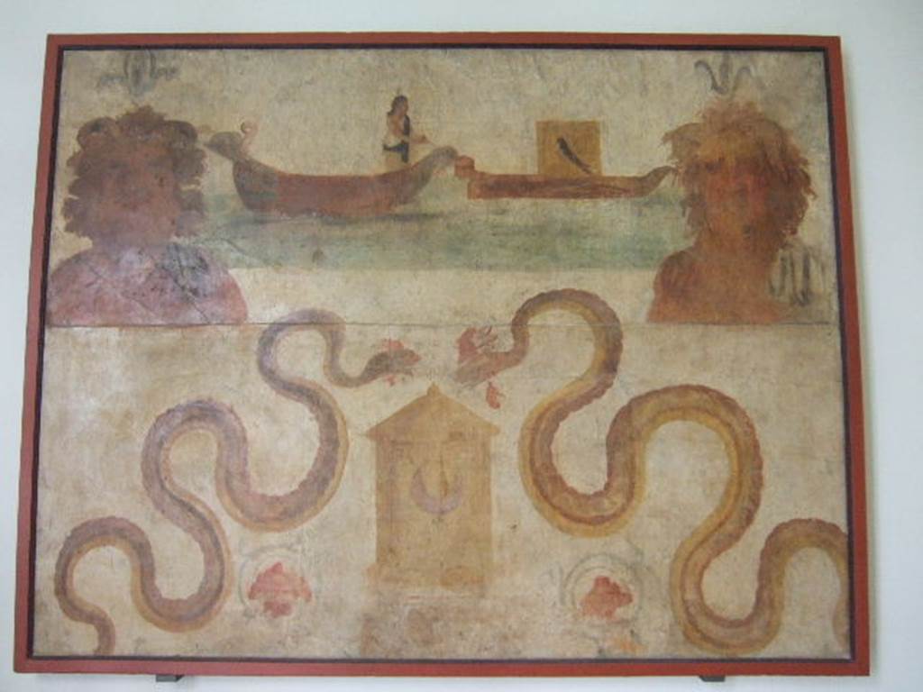 VIII.7.28 Pompeii. Found on north wall of the sacrarium. Ship of Isis, transporting Osiris, and busts of river (Nile?) gods. Two serpents are moving towards a basket which has a crescent moon symbol on it. Now in Naples Archaeological Museum.  Inventory number 8929.