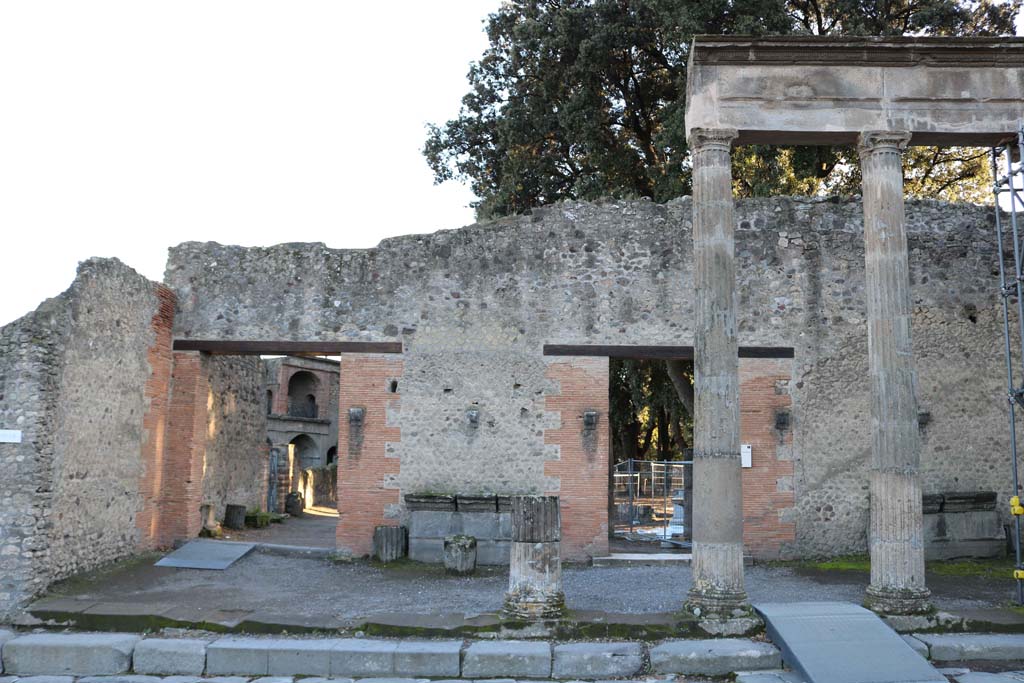 VIII.7.30 Pompeii. May 2015. Looking across Via del Tempio d’Iside to entrance, fountain and Via dei Teatri.  Photo courtesy of Buzz Ferebee. 
