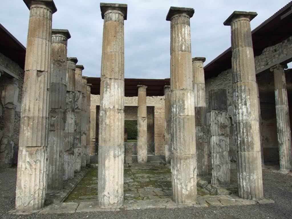 IX.1.20 Pompeii. December 2007. Room 2, atrium on east side, showing room 6, ala, with household shrine and 2 Ionic columns in opening.
