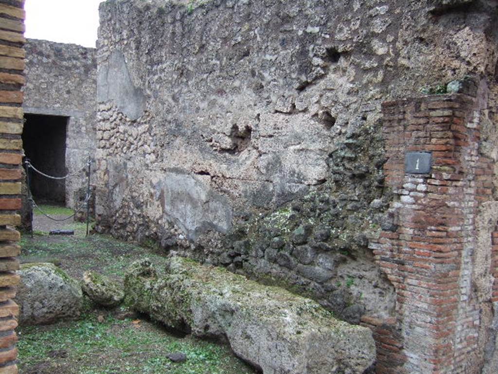 IX.2.1 Pompeii. December 2005. Street altar with Lares Compitales on south wall.