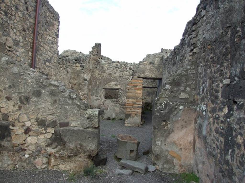 IX.2.4 Pompeii. December 2007.  East wall of shop, and doorway to atrium, with more fragments of mills.

