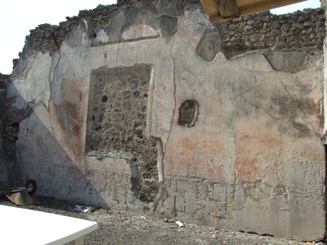 IX.2.16 Pompeii. Pre-1943. East wall at north end of atrium, with doorway to exedra. Photo by Tatiana Warscher.
According to Warscher – the painting of Hercules and Hesione has vanished (from the east wall of atrium).
Although Warscher called this room an exedra, she makes the point that this room was spacious and was probably used as a triclinium. 
The decoration was rich and exquisite of which the three new paintings were part.
See Warscher, T. Codex Topographicus Pompeianus, IX.2. (1943), Swedish Institute, Rome. (no.51.), p. 119.
