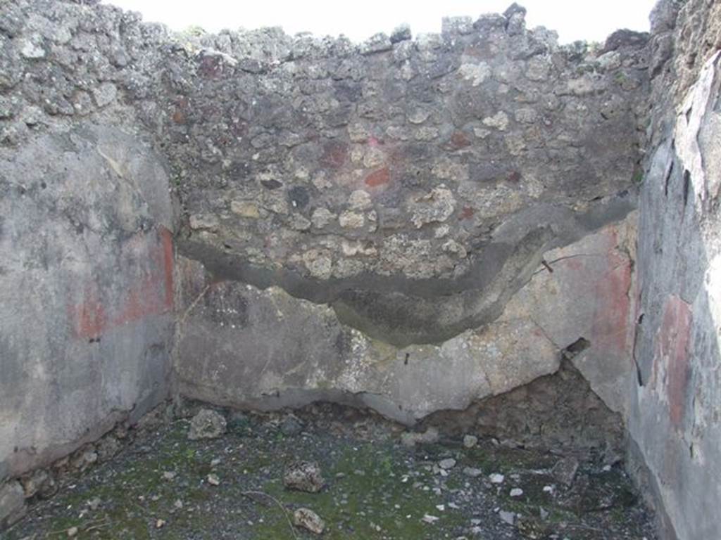 IX.2.18 Pompeii. March 2009. Room 4, west wall in cubiculum. According to PPP, the zoccolo in this room would have been black.  On the west wall the zoccolo may have had geometric painted panels with a painting in the centre of it.  On the south wall, the zoccolo was separated from the red middle zone by a white cornice. The middle zones of the walls were red.
See Bragantini, de Vos, Badoni, 1986. Pitture e Pavimenti di Pompei, Parte 3. Rome: ICCD. (p.421)
