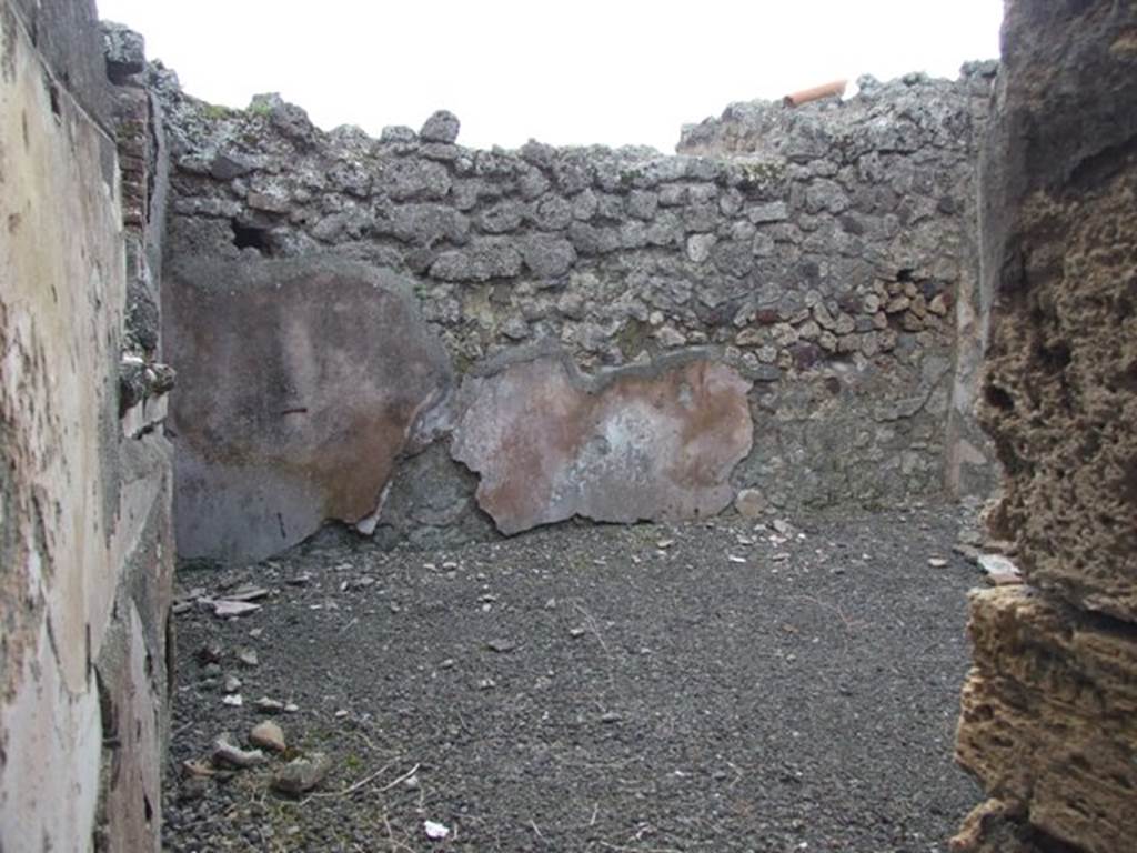 IX.2.24 Pompeii.  March 2009.   West wall with remains of plaster in room on west side of corridor.