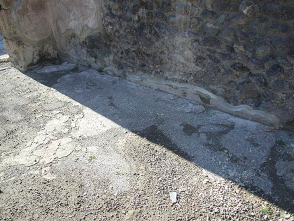 IX.3.3 Pompeii. March 2009. North wall of shop and floor. Looking north-west to entrance..