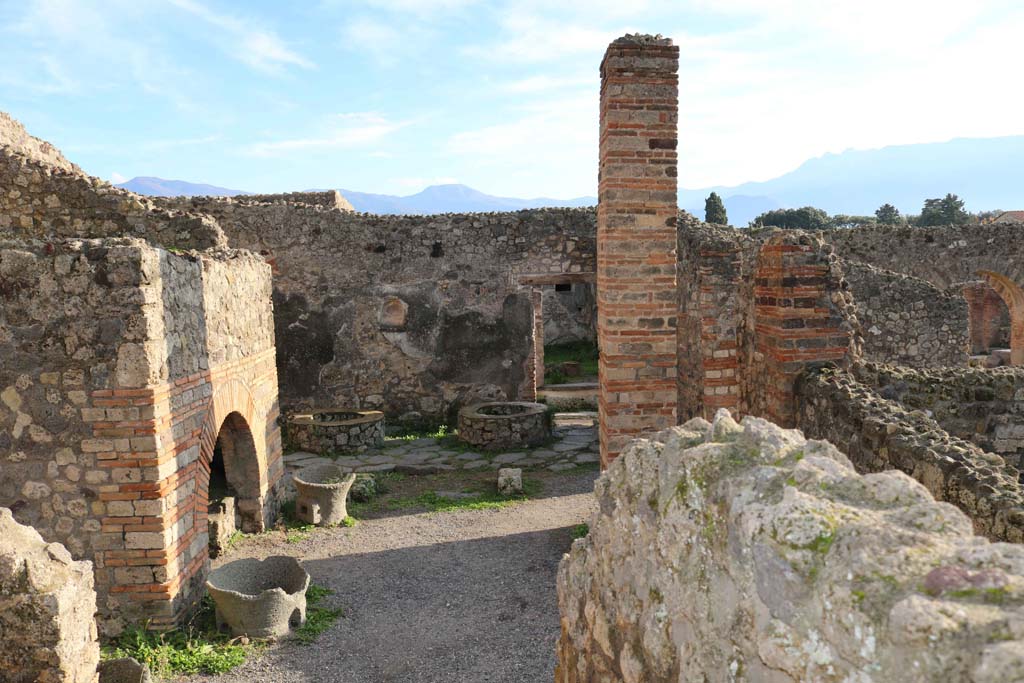 IX.3.12 Pompeii. December 2018. Looking south across bakery, towards south wall with niche. Photo courtesy of Aude Durand.
