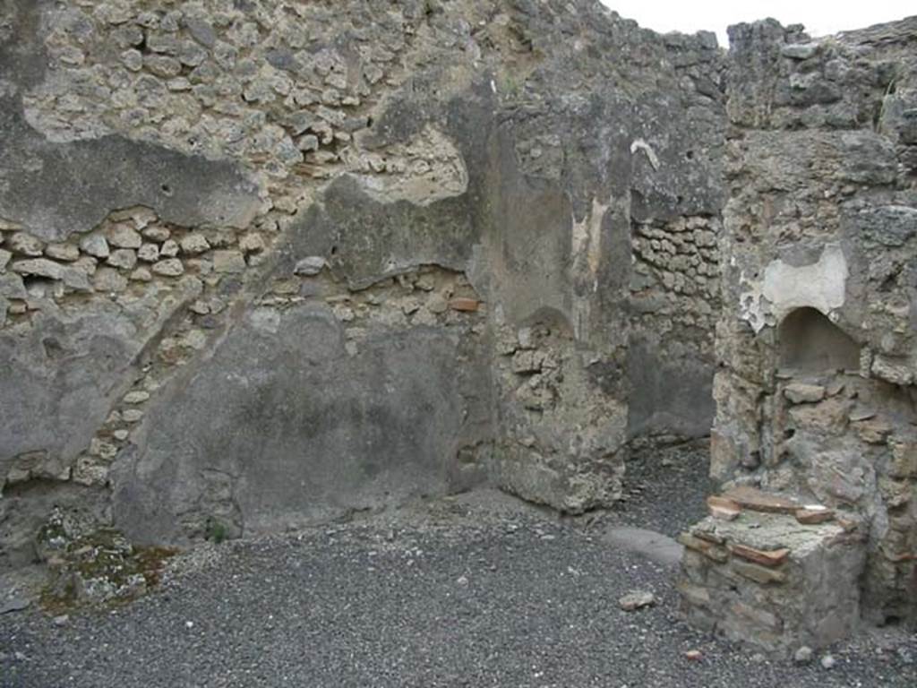 IX.3.14 Pompeii. May 2003. Outline of staircase in the plaster on west wall, and niche and altar on north wall.   Photo courtesy of Nicolas Monteix.
