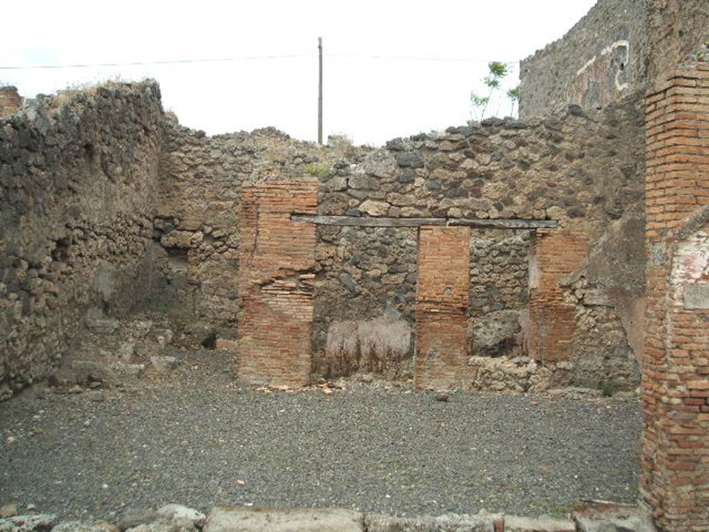 IX.3.18  Pompeii. May 2005.  Looking north across shop to rear rooms.