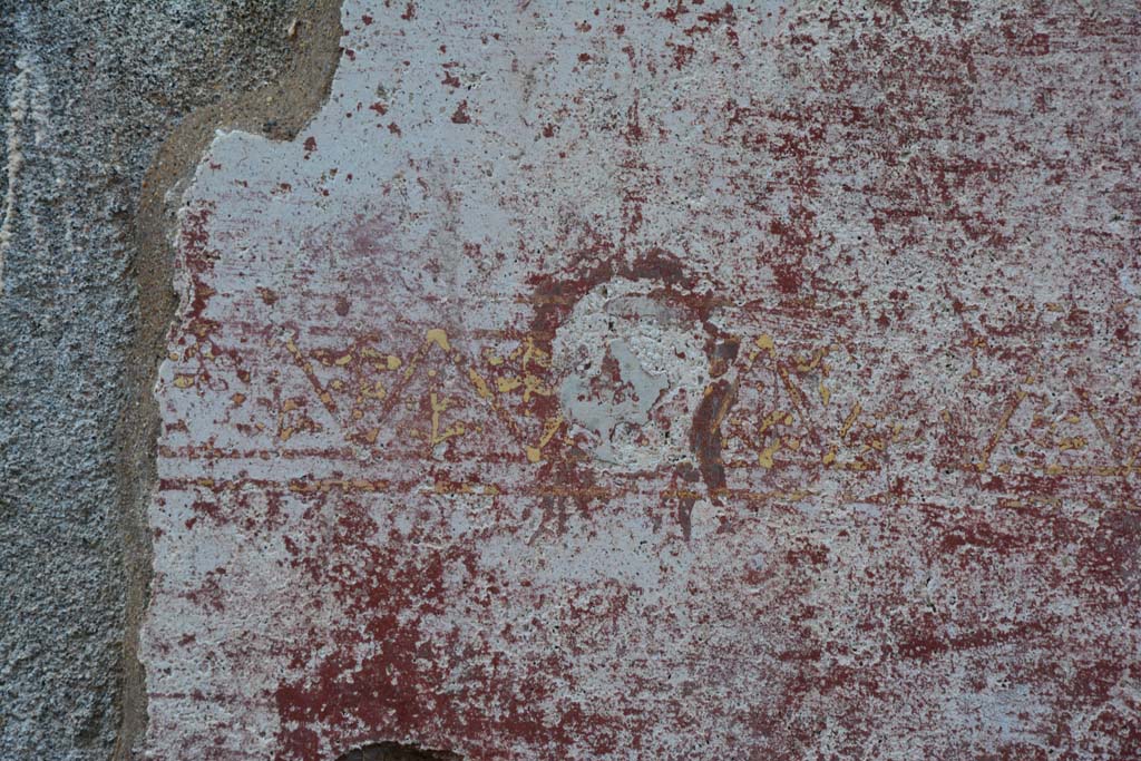 IX.5.11 Pompeii. March 2017. Room I (L), detail of painted mask from zoccolo at north end of east wall.
Foto Christian Beck, ERC Grant 681269 DCOR.

